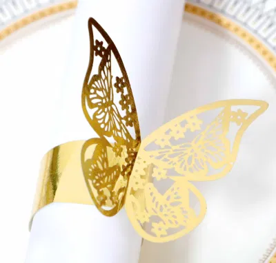 カスタム卸売 DIY レーザー中空蝶ナプキンリングゴールデン紙バックルタオルテーブル装飾結婚式の弓テーブルクロスナプキンリング